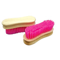 Brosse à visage en bois rose pour soins de la peau, conçue pour un nettoyage doux et naturel du visage.